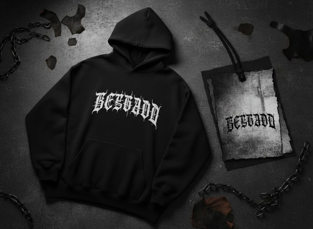 Custom gothic brand lettering printed on a black premium streetwear hoodie