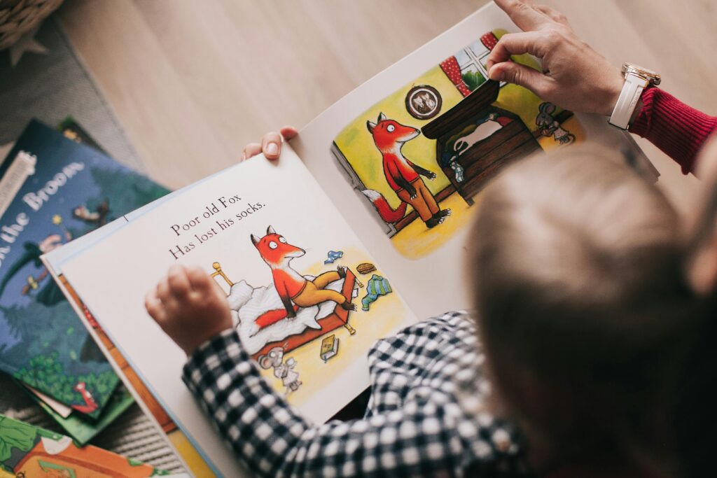 Parents reading a picture book with their children