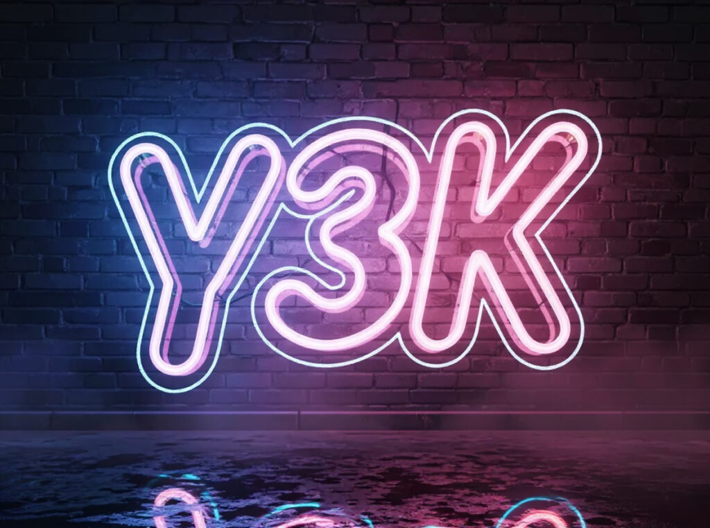 Cinematic neon bubble font on a dark brick wall.